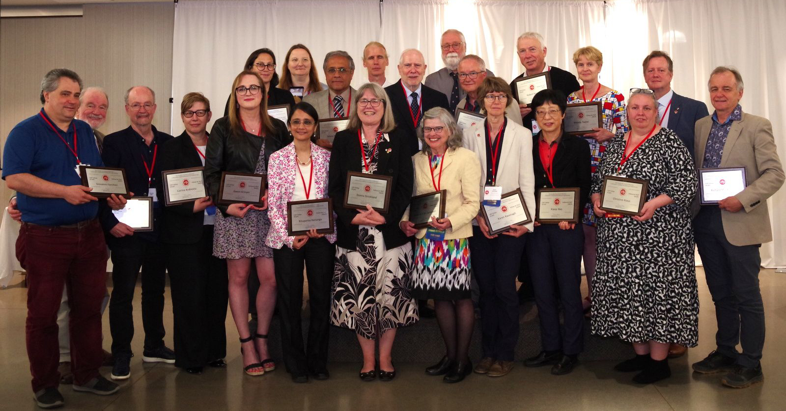 Image of 2022-2024 Fellows attending Recognition Dinner, with commemorative plaque and Fellow pins, plus 2024 CAP-CRM Prize and 2024 Vogt Medal recipients